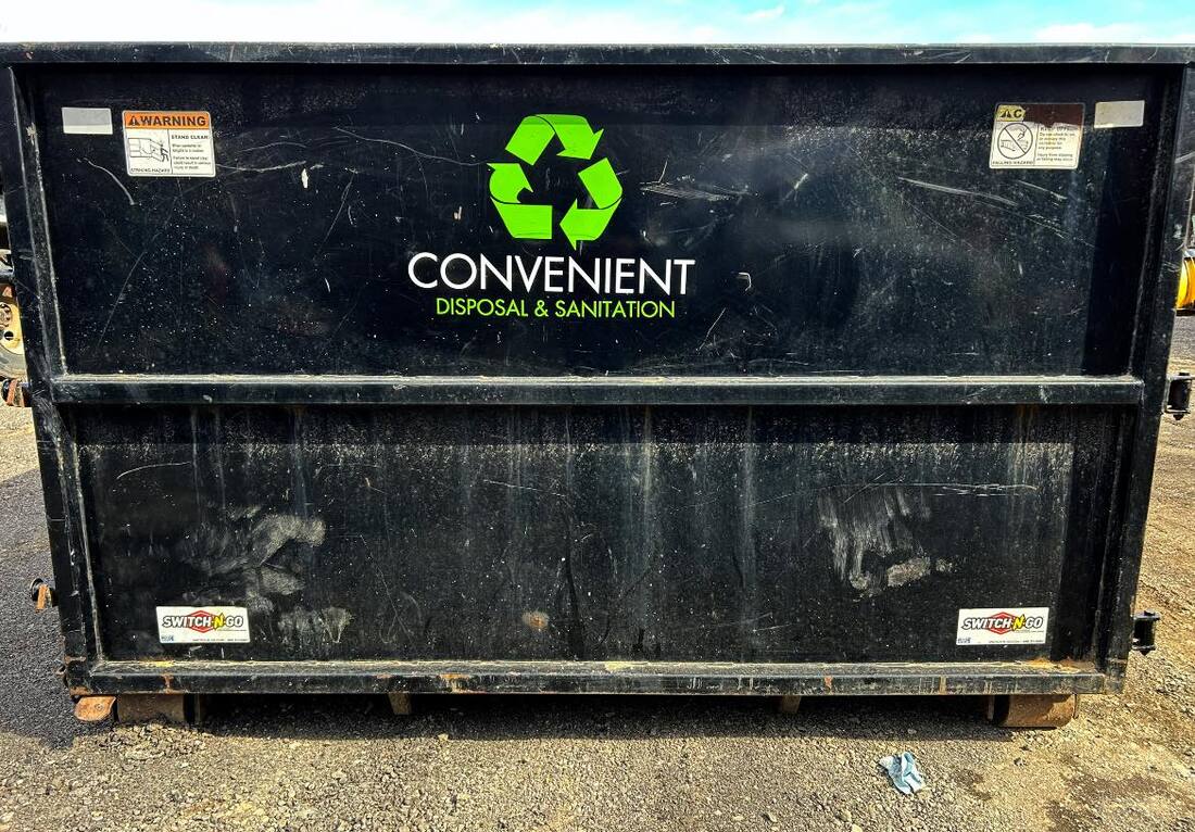 logo on side of dumpster